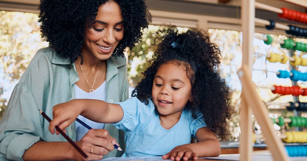 Teacher and child doing math